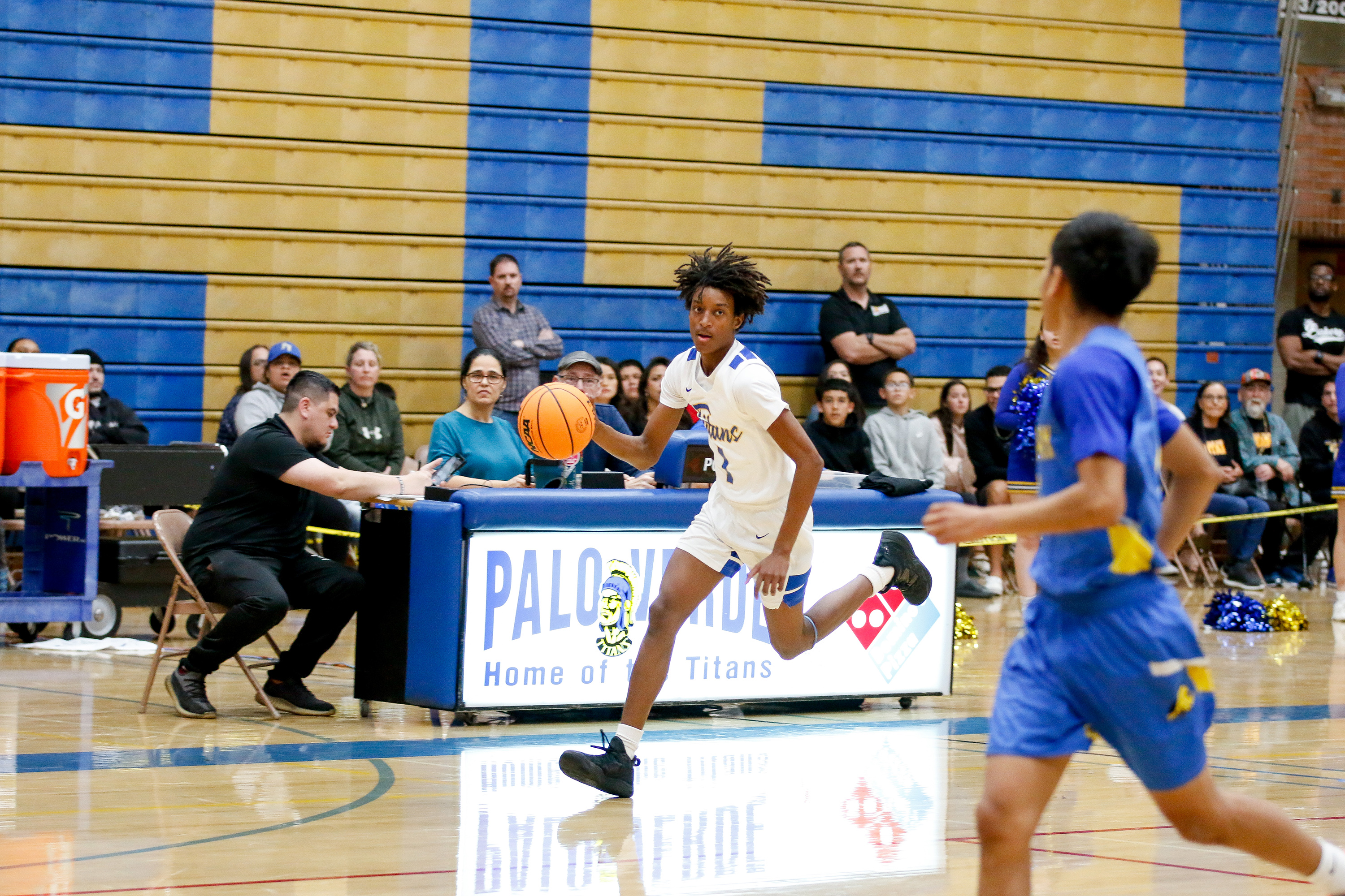 A PV player dribbles the ball down the court