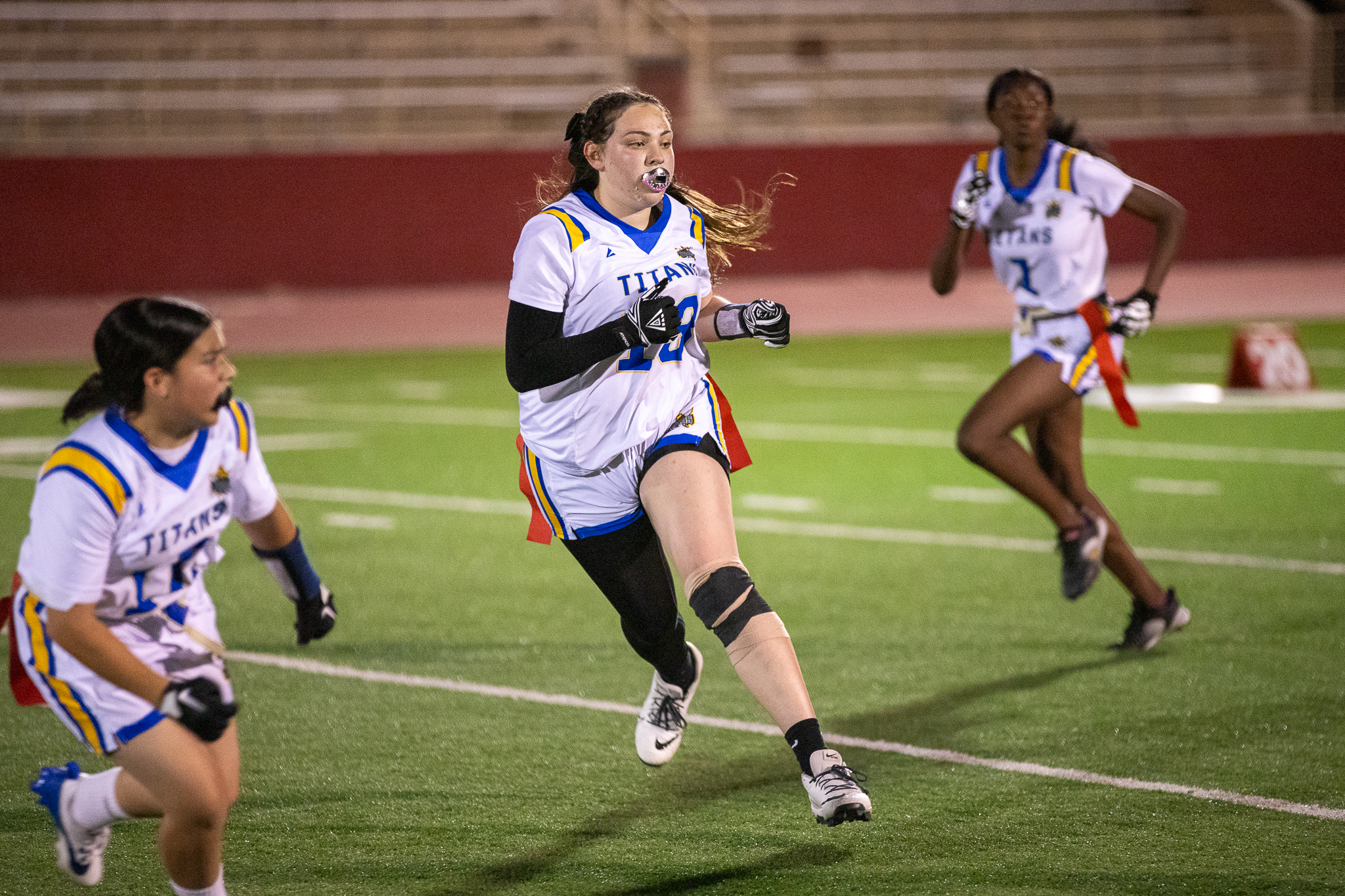 Three Palo Verde players charge up the field