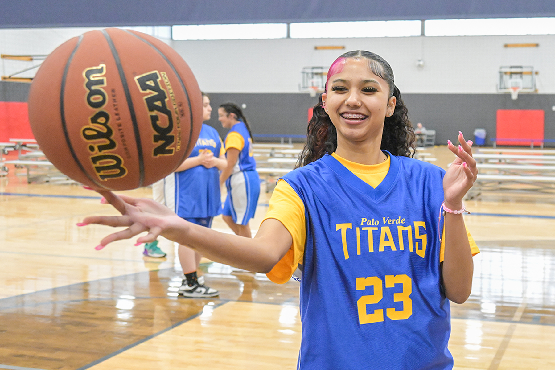 A girl shows off her basketball twirling skills