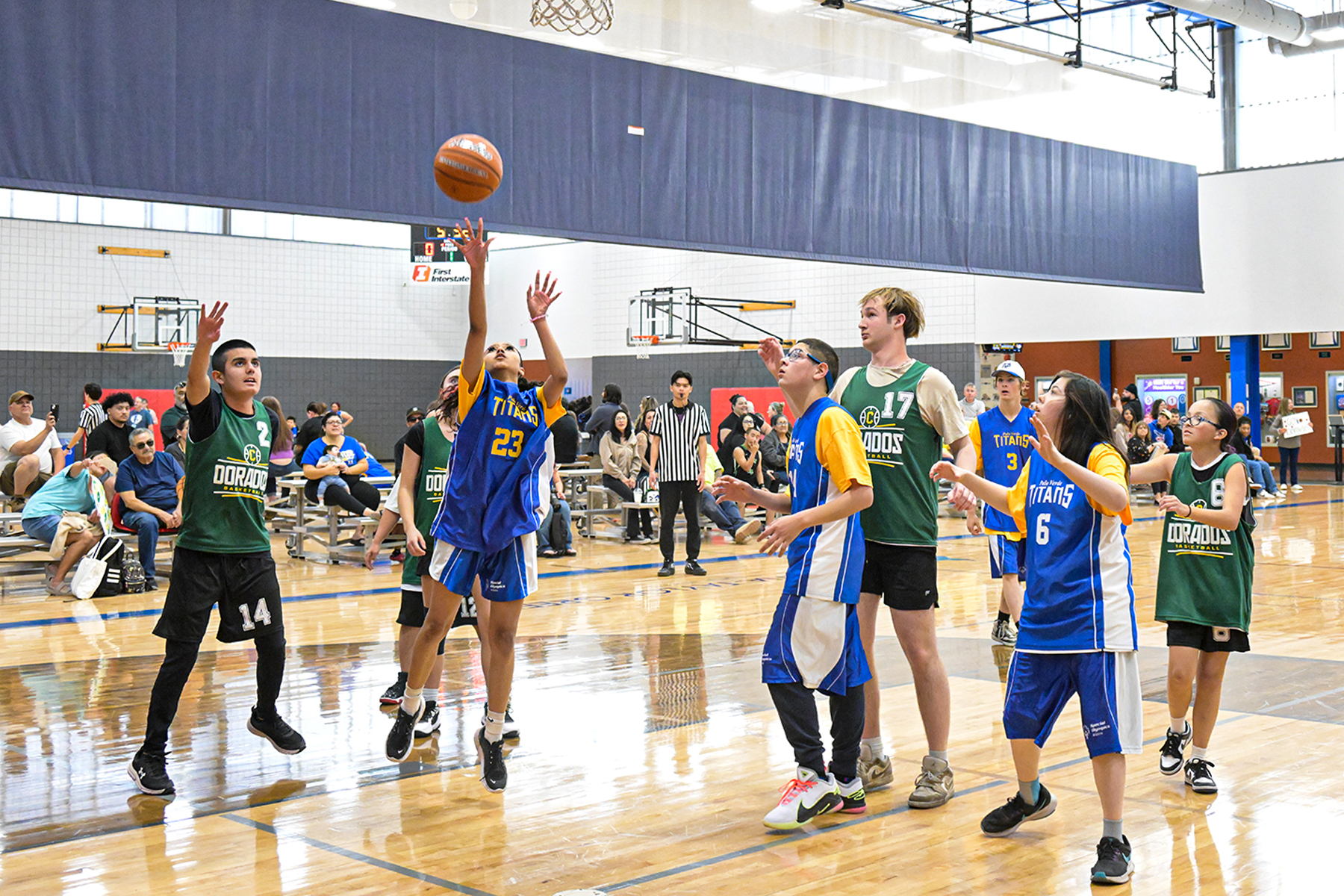 A girl shoots a basket