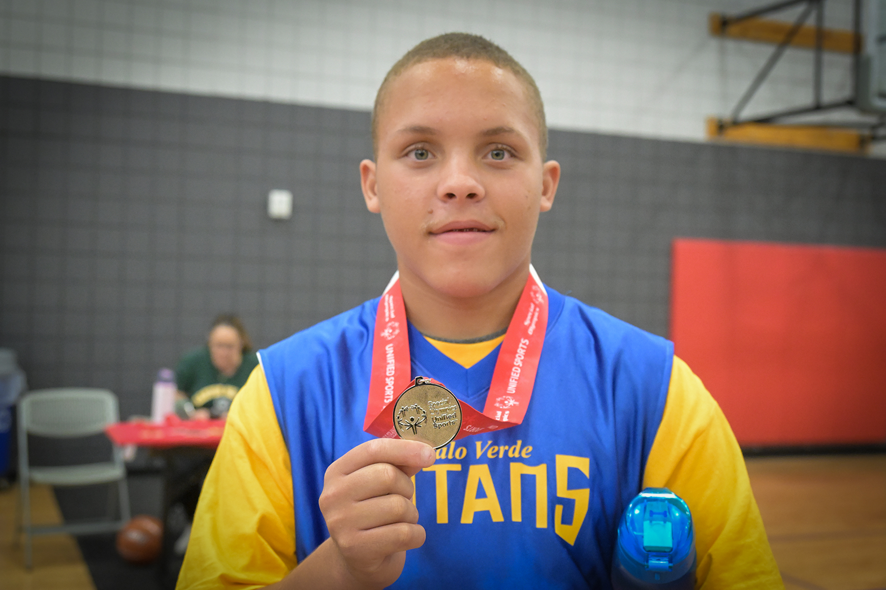 A boy shows off his silver medal