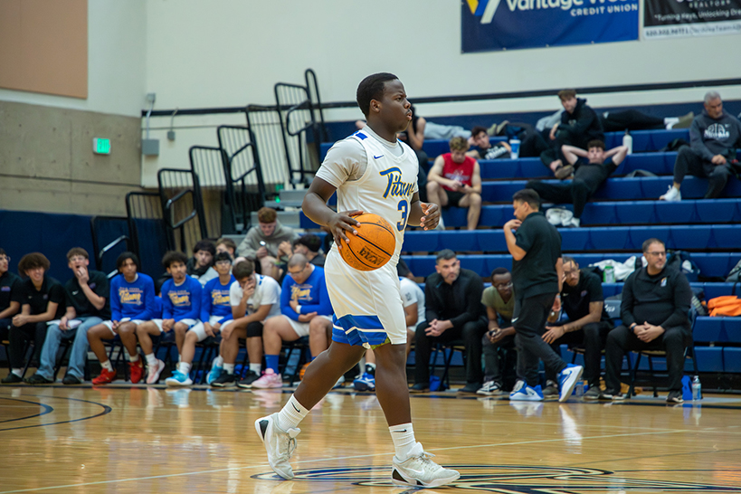 A Palo Verde player dribbles the ball down the court