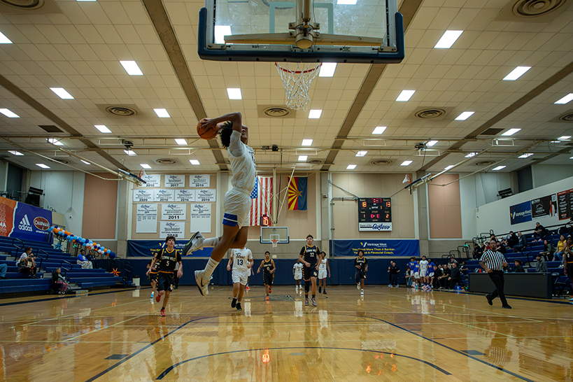 A Palo Verde player jumps up to shoot the ball into the basket