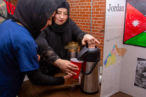 Coffee from Jordan is served by a student.